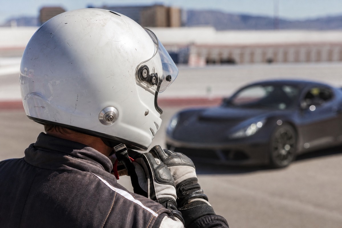 Racing helmet and gloves on the pit wall before a Las Vegas supercar drive