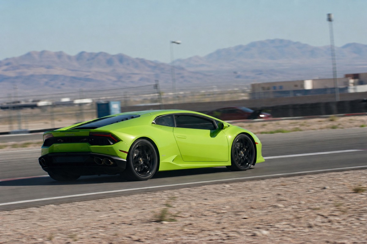 Supercar attacking an apex on the Las Vegas desert racetrack